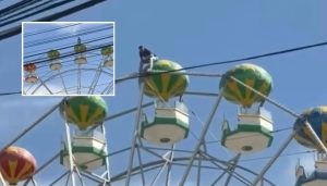 Homem é flagrado no topo de roda-gigante em Caldas Novas (GO) e chama atenção de visitantes